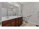 Bright bathroom with double sinks, a large mirror, and a toilet with safety bars at 232 Je Edward Dr. # 21, Myrtle Beach, SC 29588