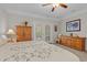 Comfortable bedroom featuring a ceiling fan, chest of drawers, and access to a patio at 232 Je Edward Dr. # 21, Myrtle Beach, SC 29588