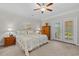 Cozy bedroom with a ceiling fan, bedside tables, and access to a patio at 232 Je Edward Dr. # 21, Myrtle Beach, SC 29588