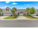 Inviting townhomes boast attached garages, well-kept lawns, and mature trees enhancing the community's charm at 232 Je Edward Dr. # 21, Myrtle Beach, SC 29588