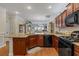 Spacious kitchen featuring a breakfast bar with dark wood cabinets, and modern appliances at 232 Je Edward Dr. # 21, Myrtle Beach, SC 29588