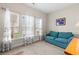 Inviting living room bathed in natural light, complemented by a comfortable sofa and light-filtering curtains at 232 Je Edward Dr. # 21, Myrtle Beach, SC 29588
