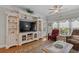 Well-appointed living room featuring a large entertainment center, comfortable seating, and stylish decor at 232 Je Edward Dr. # 21, Myrtle Beach, SC 29588