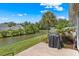 Backyard patio with lush landscaping overlooking a serene waterway, perfect for outdoor relaxation and grilling at 232 Je Edward Dr. # 21, Myrtle Beach, SC 29588