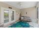 Relaxing screened porch featuring comfortable seating, ceiling fan, and neutral tones perfect for unwinding at 232 Je Edward Dr. # 21, Myrtle Beach, SC 29588