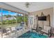 Cozy screened-in porch offers a tranquil view of the waterway, comfortable seating, and outdoor relaxation at 232 Je Edward Dr. # 21, Myrtle Beach, SC 29588