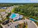 Aerial view of the community pool and recreational amenities, with surrounding trees and parking at 2464 Rock Dove Rd., Myrtle Beach, SC 29577
