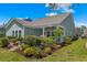 Inviting backyard with lush landscaping, a covered patio, and an outdoor grill at 2464 Rock Dove Rd., Myrtle Beach, SC 29577