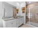 Elegant bathroom with double vanity, granite countertops, and a tiled shower at 2464 Rock Dove Rd., Myrtle Beach, SC 29577