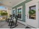 Inviting front porch with rocking chairs and decorative details, offering a relaxing outdoor space at 2464 Rock Dove Rd., Myrtle Beach, SC 29577