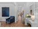 Hallway with hardwood floors, stylish decor, and a view to the spacious living areas beyond at 2464 Rock Dove Rd., Myrtle Beach, SC 29577