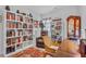Cozy office with bookshelves, a leather chair, and a decorative area rug at 2464 Rock Dove Rd., Myrtle Beach, SC 29577