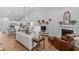 Bright, airy living area with a fireplace, tv, and open access to kitchen at 2464 Rock Dove Rd., Myrtle Beach, SC 29577