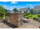 Outdoor kitchen featuring a built-in grill, countertop, and seating area at 2464 Rock Dove Rd., Myrtle Beach, SC 29577