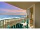 Relax on the balcony with stunning sunset ocean views and comfortable Adirondack chairs at 2507 S Ocean Blvd. # 403, North Myrtle Beach, SC 29582