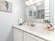 Well-lit bathroom vanity with mirror and decorative seahorse art at 2507 S Ocean Blvd. # 403, North Myrtle Beach, SC 29582