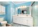 Bright bathroom with a double vanity, shower, and coastal decor at 2507 S Ocean Blvd. # 403, North Myrtle Beach, SC 29582