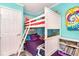 bedroom featuring a bunk bed with colorful decor and gray plank flooring at 2507 S Ocean Blvd. # 403, North Myrtle Beach, SC 29582