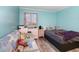 Bright bedroom with large window, gray plank flooring and comfortable seating at 2507 S Ocean Blvd. # 403, North Myrtle Beach, SC 29582