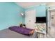 Bright bedroom with large window, gray plank flooring and comfortable seating at 2507 S Ocean Blvd. # 403, North Myrtle Beach, SC 29582