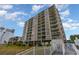 Exterior view of condominium building featuring multiple balconies and ocean views at 2507 S Ocean Blvd. # 403, North Myrtle Beach, SC 29582