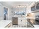 Kitchen featuring stainless appliances, marbled countertops and gray wood flooring at 2507 S Ocean Blvd. # 403, North Myrtle Beach, SC 29582