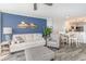 Cozy living room with stylish sofa and armchair, adjacent to a dining area and kitchen at 2507 S Ocean Blvd. # 403, North Myrtle Beach, SC 29582