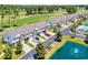 Aerial view of townhomes with golf course and water feature offering scenic community living at 260 Connemara Dr. # E, Myrtle Beach, SC 29579