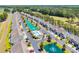 Aerial view of a community with manicured lawns, mature trees and a swimming pool and waterways at 260 Connemara Dr. # E, Myrtle Beach, SC 29579