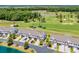 An aerial view showing the townhomes next to a golf course with several ponds and mature trees at 260 Connemara Dr. # E, Myrtle Beach, SC 29579