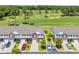 Beautiful aerial view of townhomes overlooking a well-manicured golf course and pond at 260 Connemara Dr. # E, Myrtle Beach, SC 29579