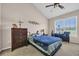 Bedroom featuring a vaulted ceiling, ceiling fan, and a bright window at 260 Connemara Dr. # E, Myrtle Beach, SC 29579