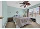 Bedroom featuring a ceiling fan, window, and a wicker nightstand at 260 Connemara Dr. # E, Myrtle Beach, SC 29579