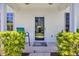 Welcoming front porch with charming decor, including a decorative wreath and comfortable seating at 260 Connemara Dr. # E, Myrtle Beach, SC 29579