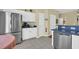 Well-equipped kitchen with stainless steel refrigerator, white cabinetry, and ample counter space at 260 Connemara Dr. # E, Myrtle Beach, SC 29579