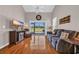 Comfortable living room featuring hardwood floors, modern decor, and sliding glass doors to the outside at 260 Connemara Dr. # E, Myrtle Beach, SC 29579