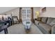 Cozy living room with plush seating, a glass coffee table, and neutral décor at 260 Connemara Dr. # E, Myrtle Beach, SC 29579