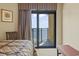 Bedroom with balcony access and ocean view provides the perfect seaside getaway at 2600 N Ocean Blvd. # 1103, Myrtle Beach, SC 29577