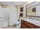 Well-lit bathroom features a granite countertop, modern vanity, and shower with tub at 2600 N Ocean Blvd. # 1103, Myrtle Beach, SC 29577