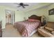 Inviting bedroom boasts a spacious layout with a comfortable chair and modern ceiling fan at 2600 N Ocean Blvd. # 1103, Myrtle Beach, SC 29577