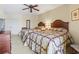 This bedroom features two queen beds, a ceiling fan, and traditional decor at 2600 N Ocean Blvd. # 1103, Myrtle Beach, SC 29577
