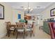 Formal dining area showcases an elegant chandelier and seamlessly connects to the open-concept kitchen at 2600 N Ocean Blvd. # 1103, Myrtle Beach, SC 29577