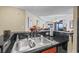 Kitchen sink with granite countertops offers views into the living area with ocean vistas at 2600 N Ocean Blvd. # 1103, Myrtle Beach, SC 29577