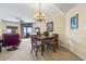 Comfortable dining area and living room with plenty of sunlight, soft carpet and a view of the ocean at 2600 N Ocean Blvd. # 1103, Myrtle Beach, SC 29577