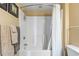 A clean tub and shower with white curtain and neutral decor makes this a relaxing bathroom at 2600 N Ocean Blvd. # 1103, Myrtle Beach, SC 29577
