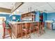 Stylish bar featuring marble countertops, wooden accents, and elegant pendant lighting at 2701 S Ocean Blvd. # 1603, North Myrtle Beach, SC 29582