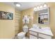 Well-lit bathroom with vanity, mirror, and convenient shelving for storage at 2701 S Ocean Blvd. # 1603, North Myrtle Beach, SC 29582