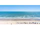 Expansive beach view highlighting the ocean, sand, beach umbrellas, and clear blue sky at 2701 S Ocean Blvd. # 1603, North Myrtle Beach, SC 29582