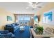 Cozy living room with a large window, comfortable seating, ceiling fan, and a dining area at 2701 S Ocean Blvd. # 1603, North Myrtle Beach, SC 29582
