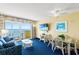 Comfortable living room with ocean view balcony, dining area, and cozy seating arrangement at 2701 S Ocean Blvd. # 1603, North Myrtle Beach, SC 29582